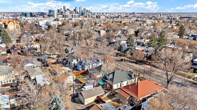 birds eye view of property with a view of city