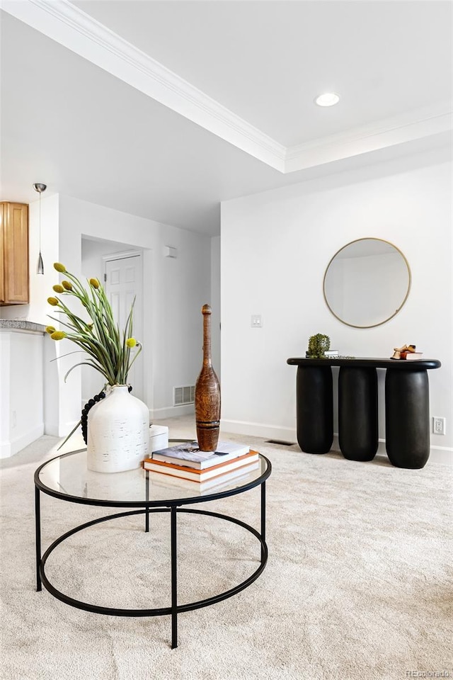 carpeted living area featuring ornamental molding, baseboards, and recessed lighting