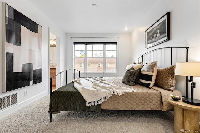 bedroom with carpet floors and baseboards