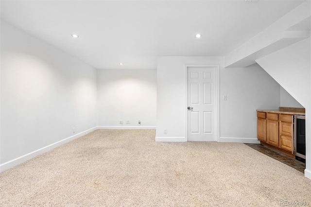 additional living space with wine cooler, carpet, recessed lighting, and baseboards