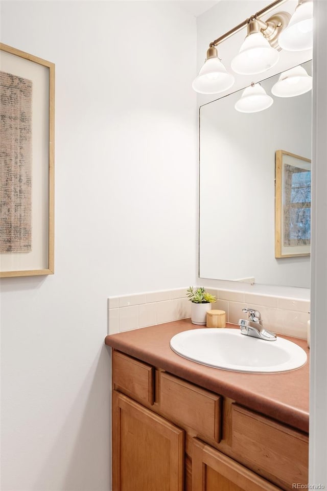 bathroom with vanity and backsplash
