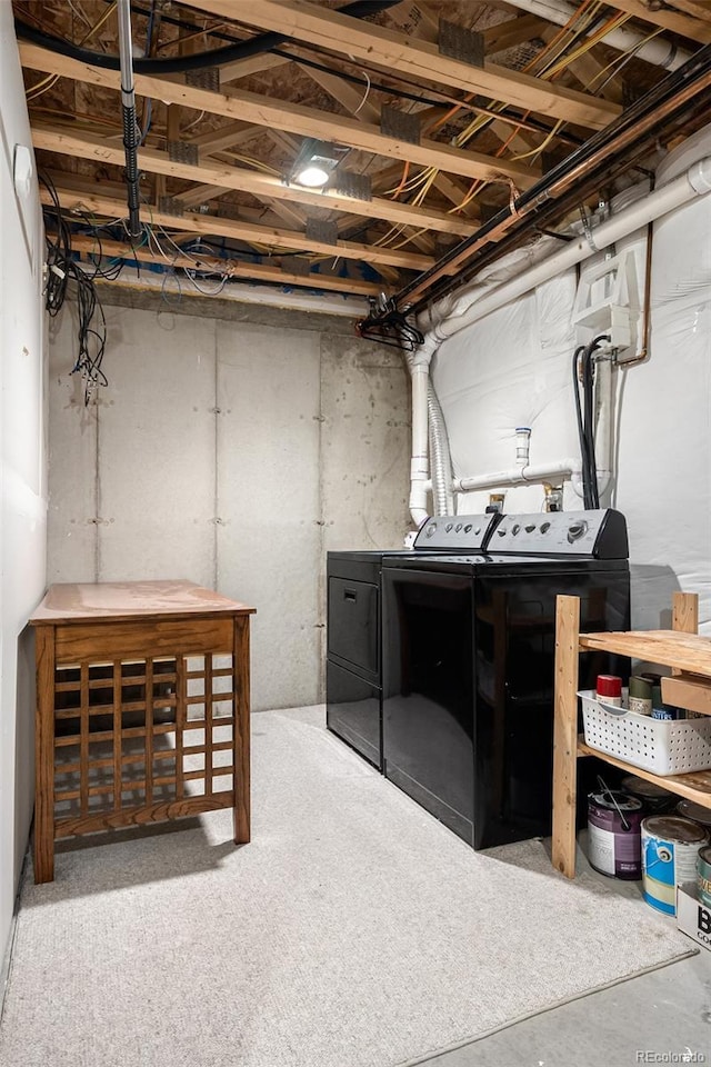 unfinished basement with washer and clothes dryer