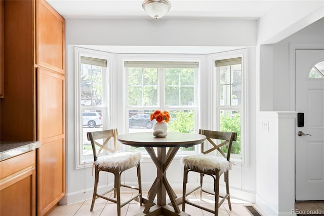 4395 E Jewell Ave Unit 3, Denver, CO 80222 - dining space with light tile patterned floors and baseboards