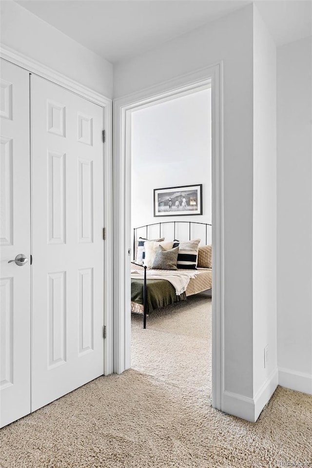 4395 E Jewell Ave Unit 3, Denver, CO 80222 - corridor featuring carpet flooring and baseboards