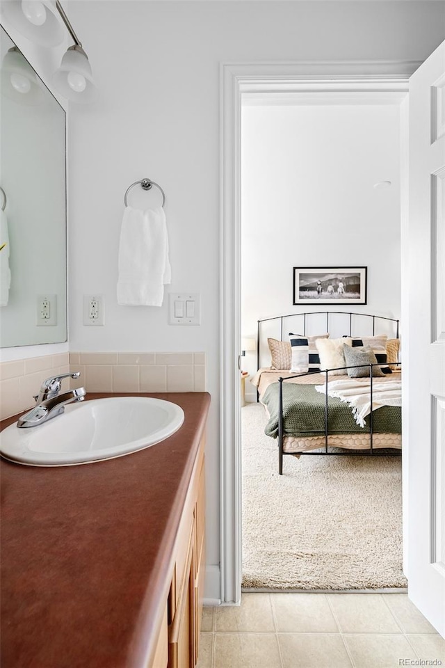 4395 E Jewell Ave Unit 3, Denver, CO 80222 - bathroom with vanity, tile patterned flooring, and ensuite bath