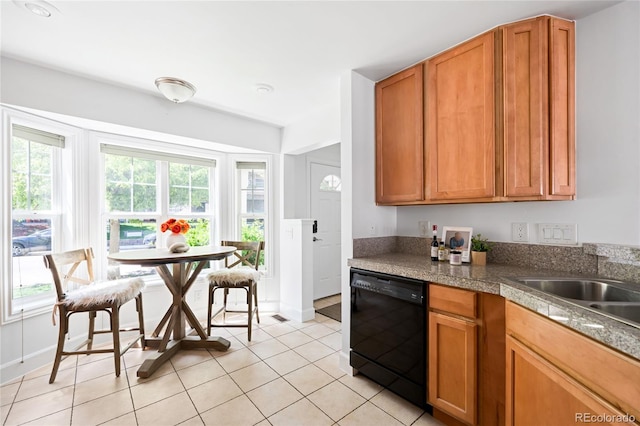 4395 E Jewell Ave Unit 3, Denver, CO 80222 - kitchen featuring black dishwasher, tile counters, light tile patterned floors, and brown cabinets