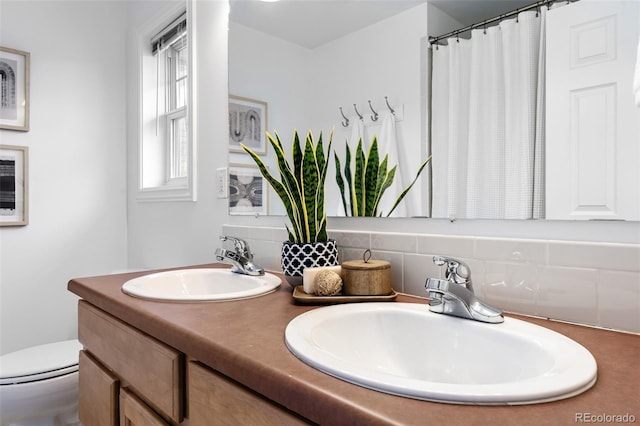 4395 E Jewell Ave Unit 3, Denver, CO 80222 - full bathroom featuring double vanity and a shower with shower curtain