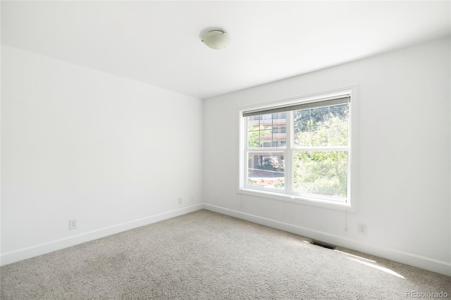 4395 E Jewell Ave Unit 3, Denver, CO 80222 - carpeted spare room featuring baseboards