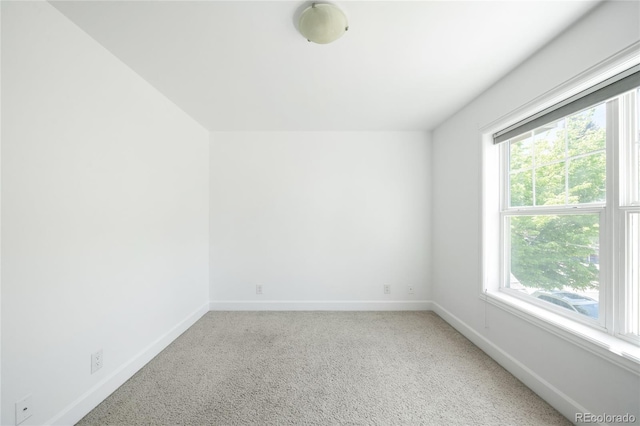 4395 E Jewell Ave Unit 3, Denver, CO 80222 - carpeted spare room featuring baseboards