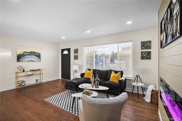 living room with dark hardwood / wood-style flooring