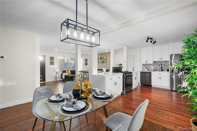 dining area with dark hardwood / wood-style flooring