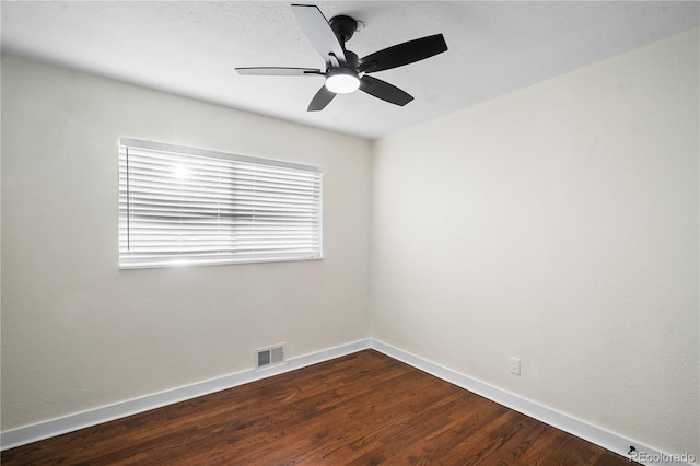 empty room with ceiling fan and hardwood / wood-style flooring