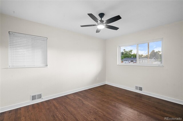 empty room with ceiling fan and hardwood / wood-style flooring