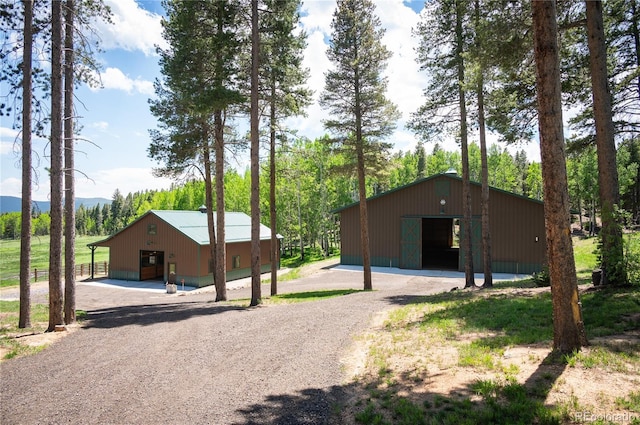 view of pole building featuring driveway