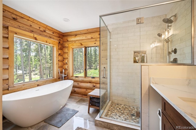 bathroom featuring a soaking tub, a shower stall, log walls, and vanity