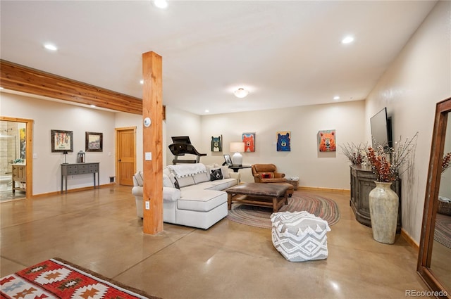 living room with recessed lighting, baseboards, and finished concrete floors