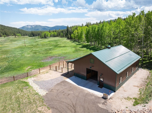 exterior space with a rural view and a mountain view