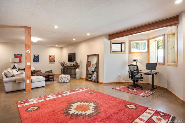 living room with recessed lighting, baseboards, a textured ceiling, and finished concrete flooring