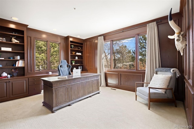 office with light carpet, ornamental molding, and a wealth of natural light