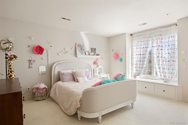 bedroom featuring light colored carpet and visible vents