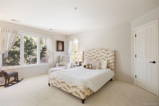 bedroom with carpet flooring, visible vents, and baseboards