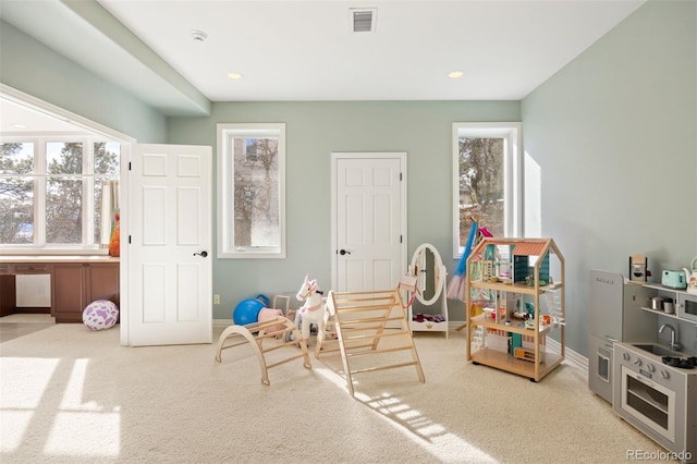 rec room with carpet floors, recessed lighting, visible vents, and baseboards