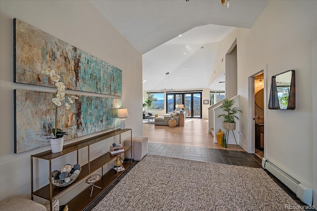 corridor featuring a baseboard radiator, high vaulted ceiling, baseboards, and recessed lighting