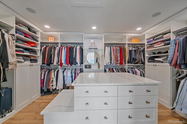 walk in closet featuring light wood-style flooring