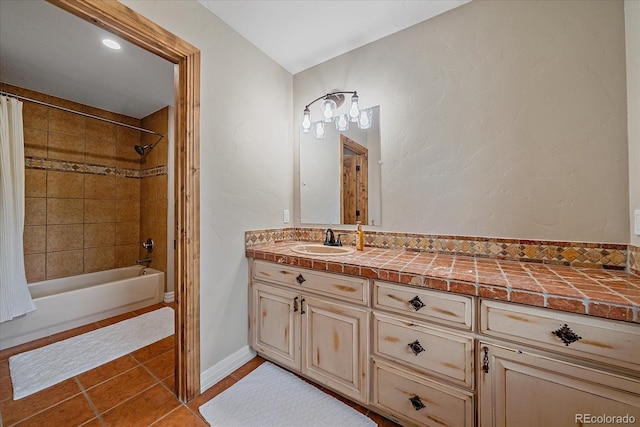 bathroom featuring tile patterned flooring, baseboards, shower / tub combo with curtain, and vanity