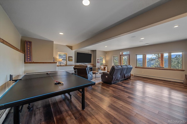 playroom with a baseboard radiator, recessed lighting, and wood finished floors