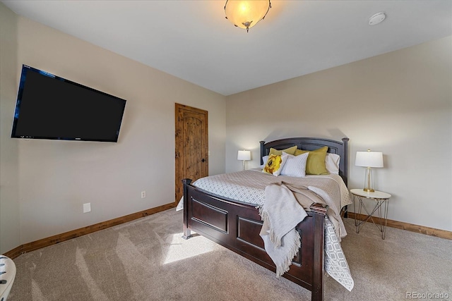 bedroom featuring carpet flooring and baseboards