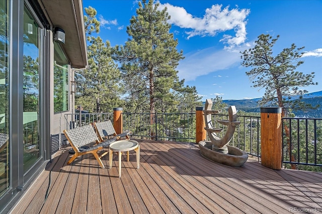 wooden terrace with a mountain view