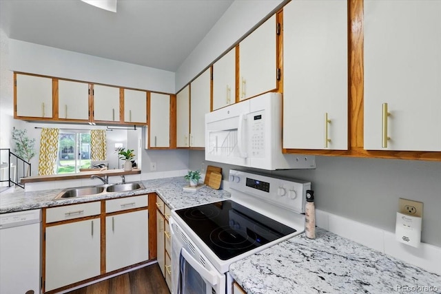 3525 Queen Anne Way, Colorado Springs, CO 80917 - kitchen with white appliances, a sink, white cabinets, and dark wood-type flooring