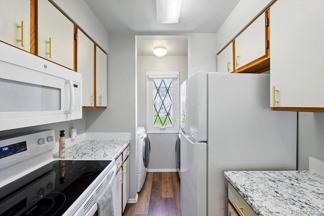 3525 Queen Anne Way, Colorado Springs, CO 80917 - kitchen with white appliances, dark wood finished floors, washer and dryer, and baseboards