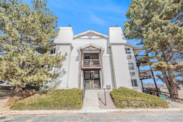 view of property featuring stairs