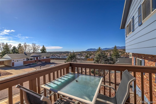 deck with a residential view and a mountain view