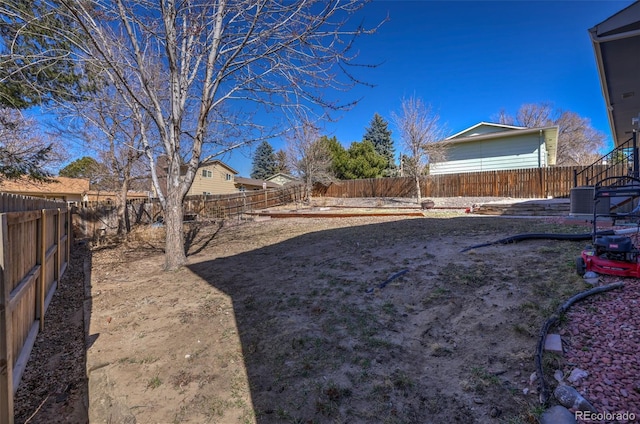 view of yard with a fenced backyard