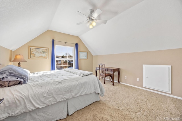 carpeted bedroom with ceiling fan and lofted ceiling