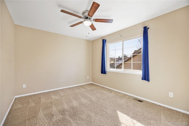 unfurnished room featuring ceiling fan and carpet