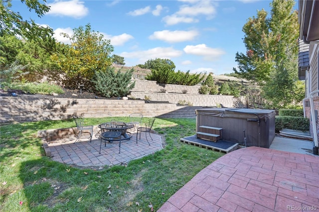 view of yard with a fire pit, a patio, and a hot tub