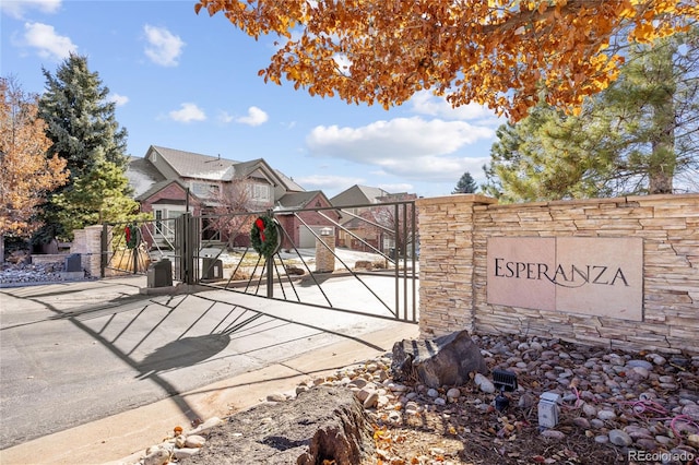 6987 Esperanza Dr, Castle Pines, CO 80108 - community / neighborhood sign featuring a gate and fence