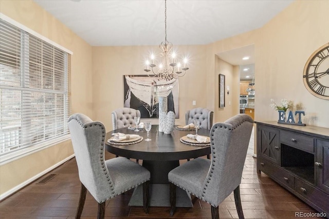 6987 Esperanza Dr, Castle Pines, CO 80108 - dining area with a chandelier, dark wood finished floors, and baseboards