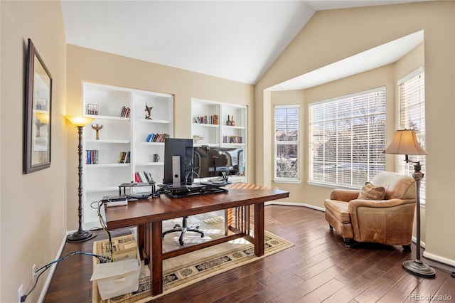 6987 Esperanza Dr, Castle Pines, CO 80108 - home office with vaulted ceiling, wood finished floors, and baseboards