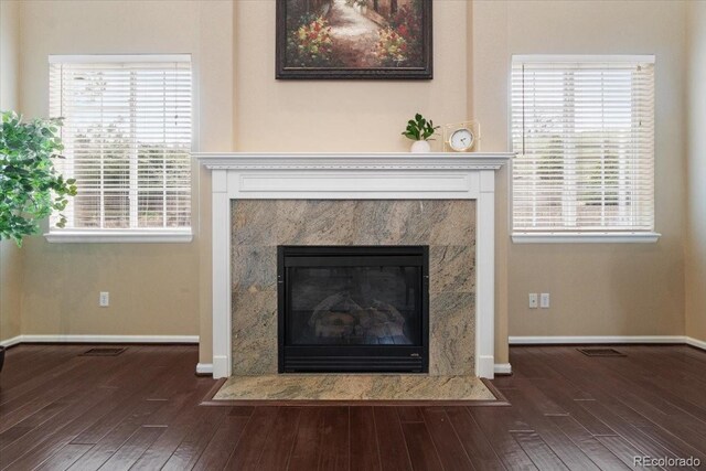 6987 Esperanza Dr, Castle Pines, CO 80108 - detailed view of wood finished floors, a fireplace, and baseboards