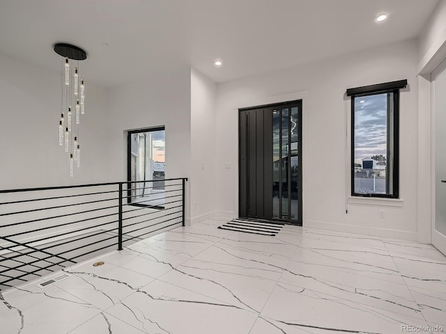 spare room featuring plenty of natural light