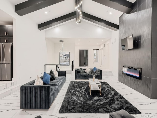 living room featuring lofted ceiling with beams, tile walls, and a fireplace