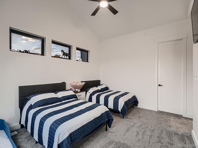 bedroom with carpet flooring, ceiling fan, and high vaulted ceiling