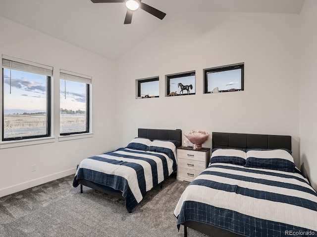 carpeted bedroom featuring lofted ceiling and ceiling fan