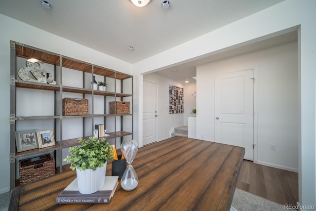 office featuring wood finished floors and baseboards