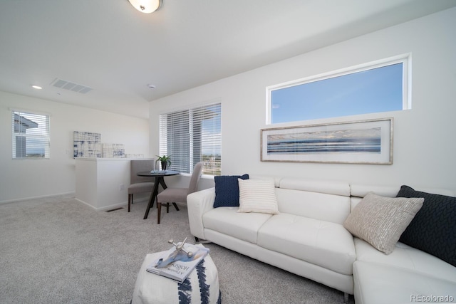 living area with recessed lighting, visible vents, baseboards, and carpet